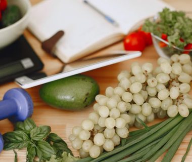 A vibrant composition of fruits, vegetables, and fitness items promoting a healthy lifestyle.